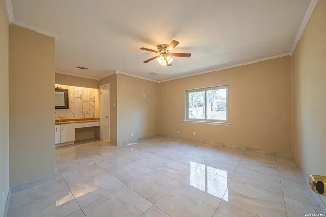 a view of an empty room with a window