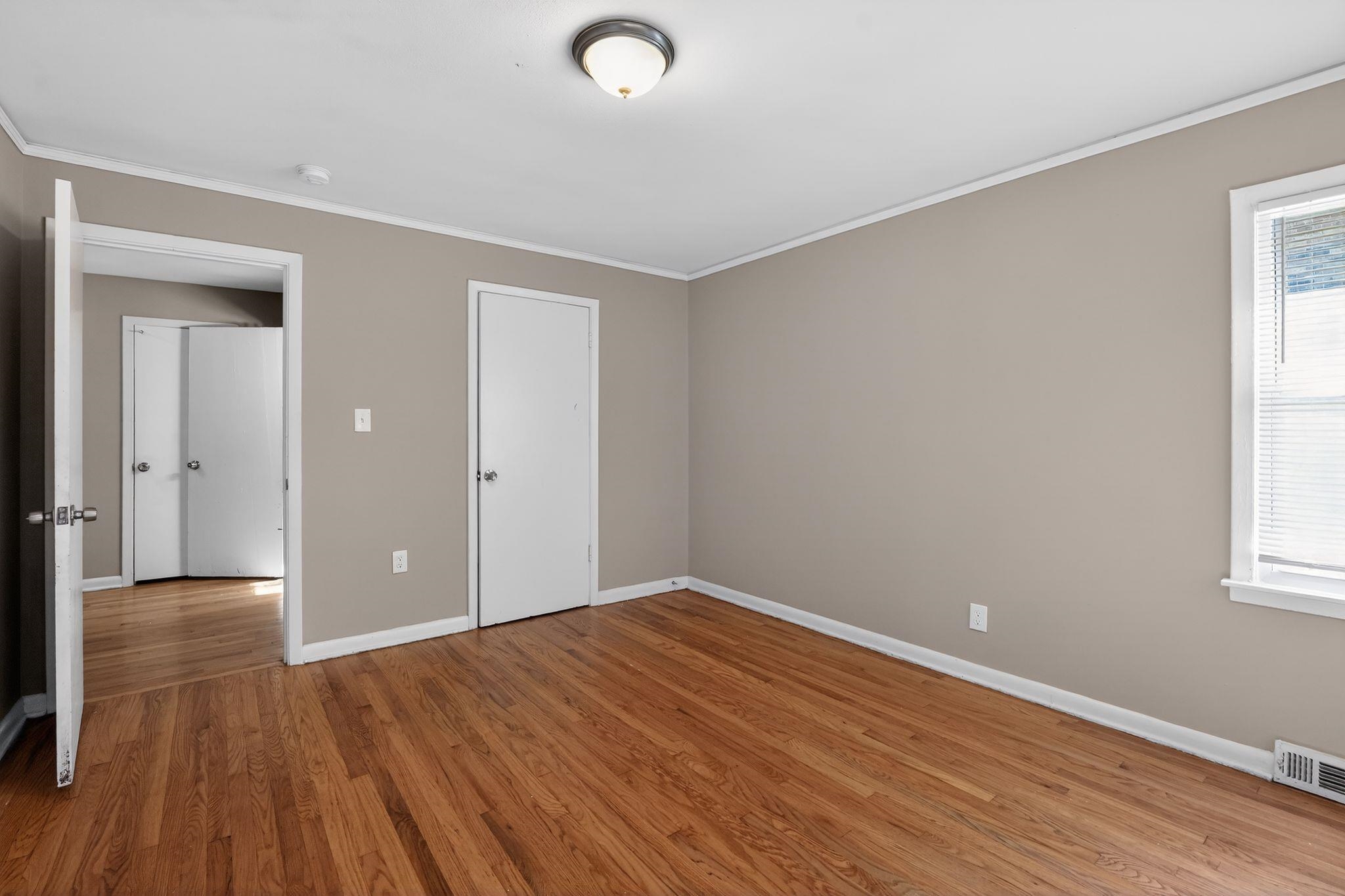 4094 Auburn Road Memphis, TN 38116 - Photo 17 of 30 wooden floor in an empty room with a window