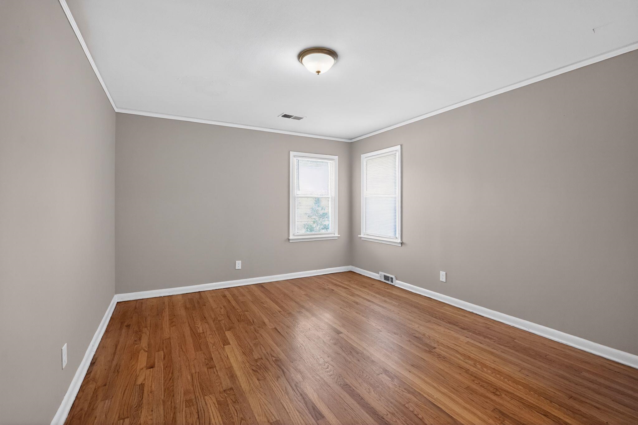 4094 Auburn Road Memphis, TN 38116 - Photo 6 of 30 wooden floor in an empty room with a window