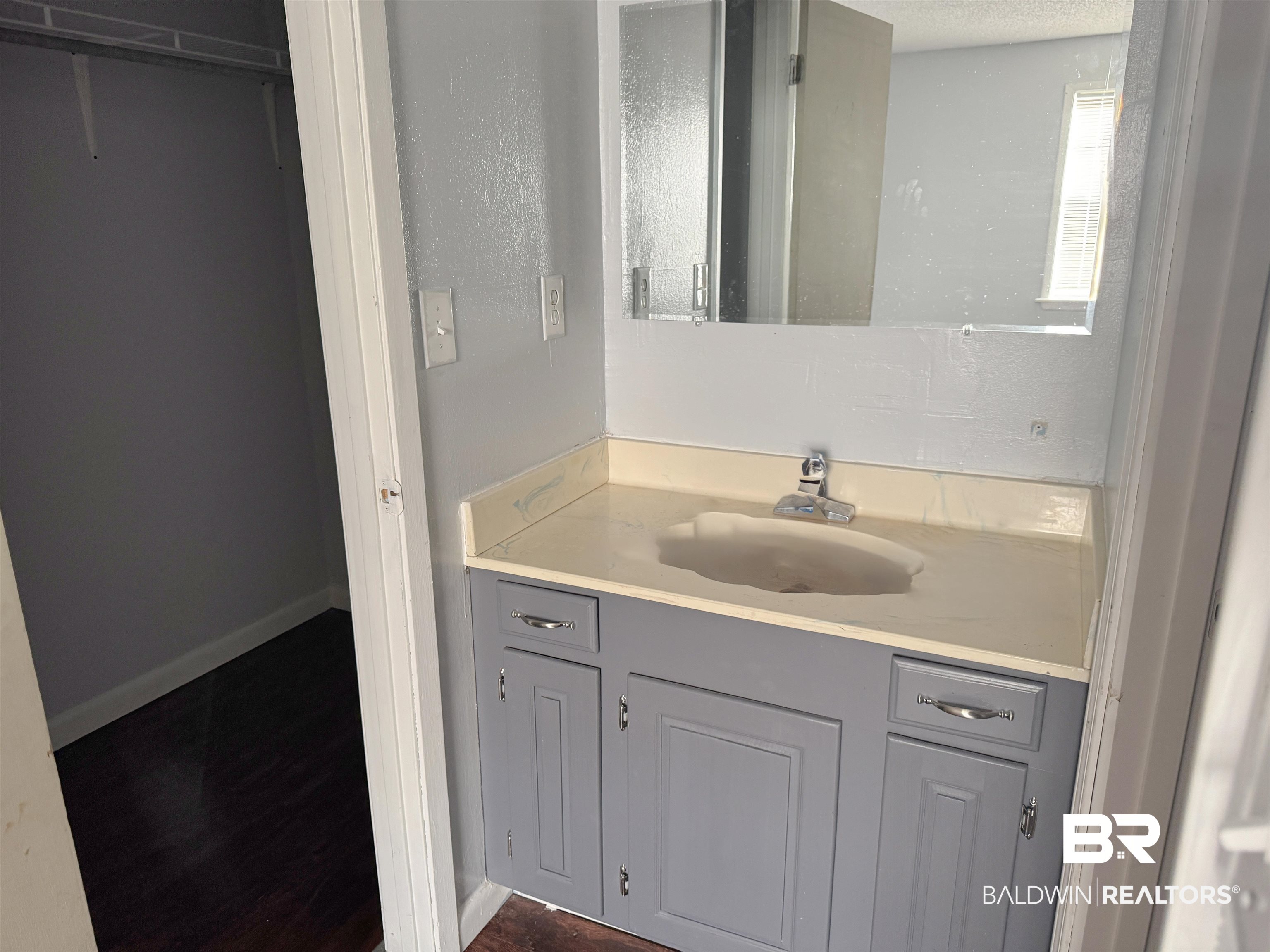 1227 Northgate Drive Atmore, AL 36502 - Photo 12 of 14 Bathroom with vanity and dark wood-style flooring