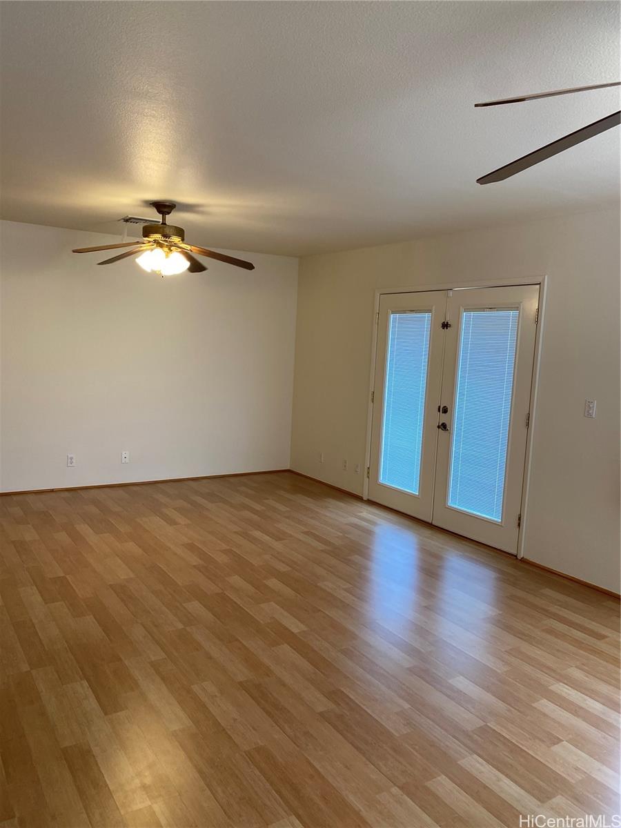 94-1017 Halepuna Street Waipahu, HI 96797 - Photo 16 of 25 a view of an empty room with wooden floor