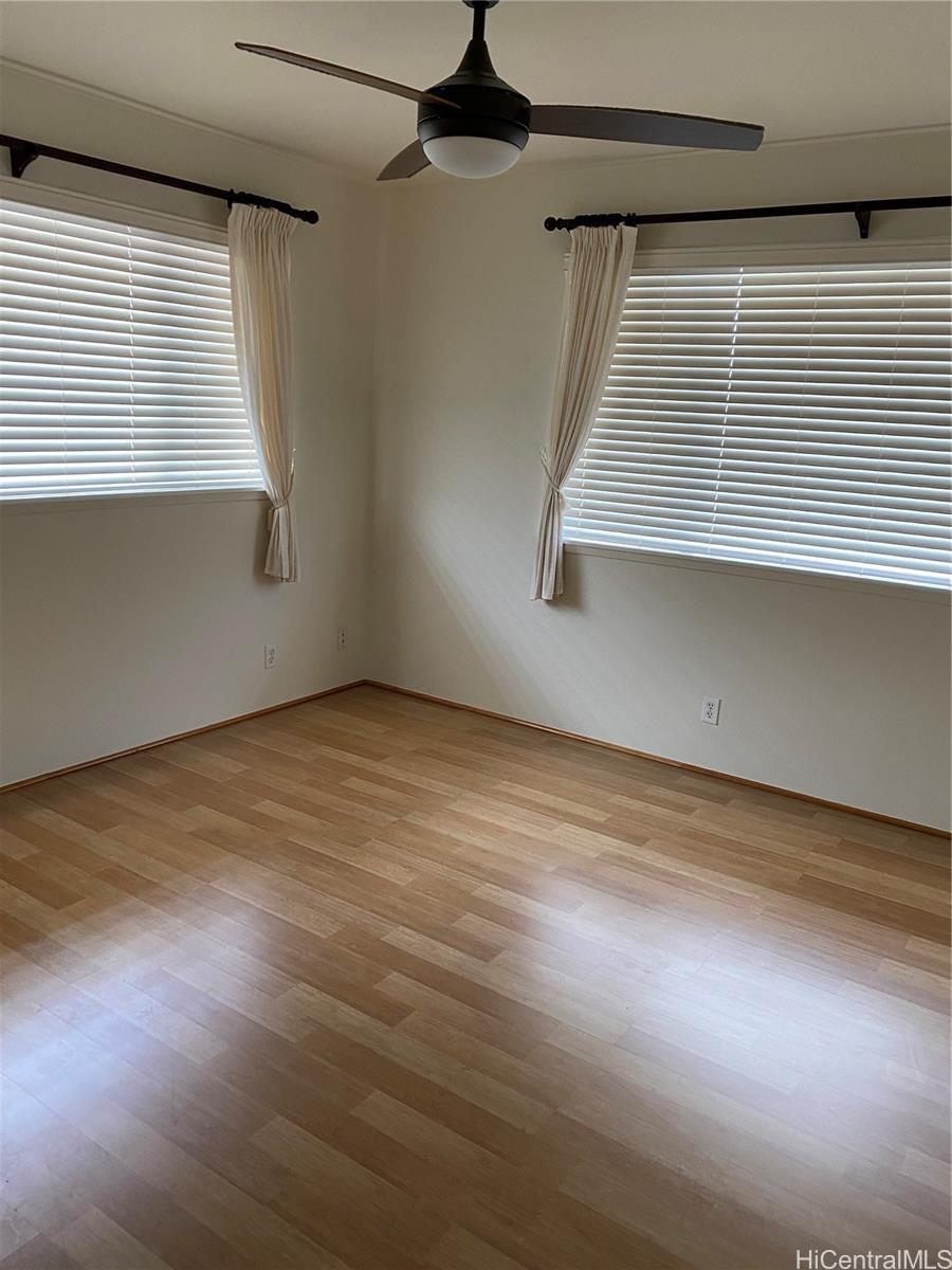 94-1017 Halepuna Street Waipahu, HI 96797 - Photo 20 of 25 an empty room with wooden floor and windows