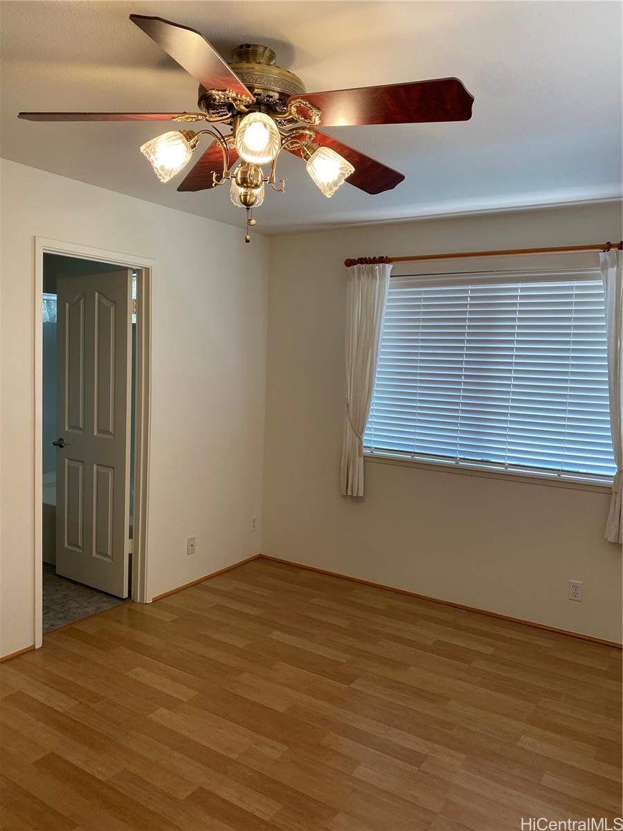 94-1017 Halepuna Street Waipahu, HI 96797 - Photo 24 of 25 a view of a room with wooden floor fan and window