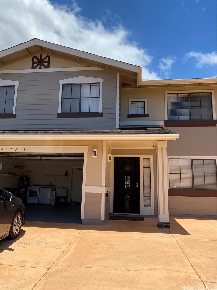 94-1017 Halepuna Street Waipahu, HI 96797 - Photo 5 of 25 a view of a building with a balcony and front door