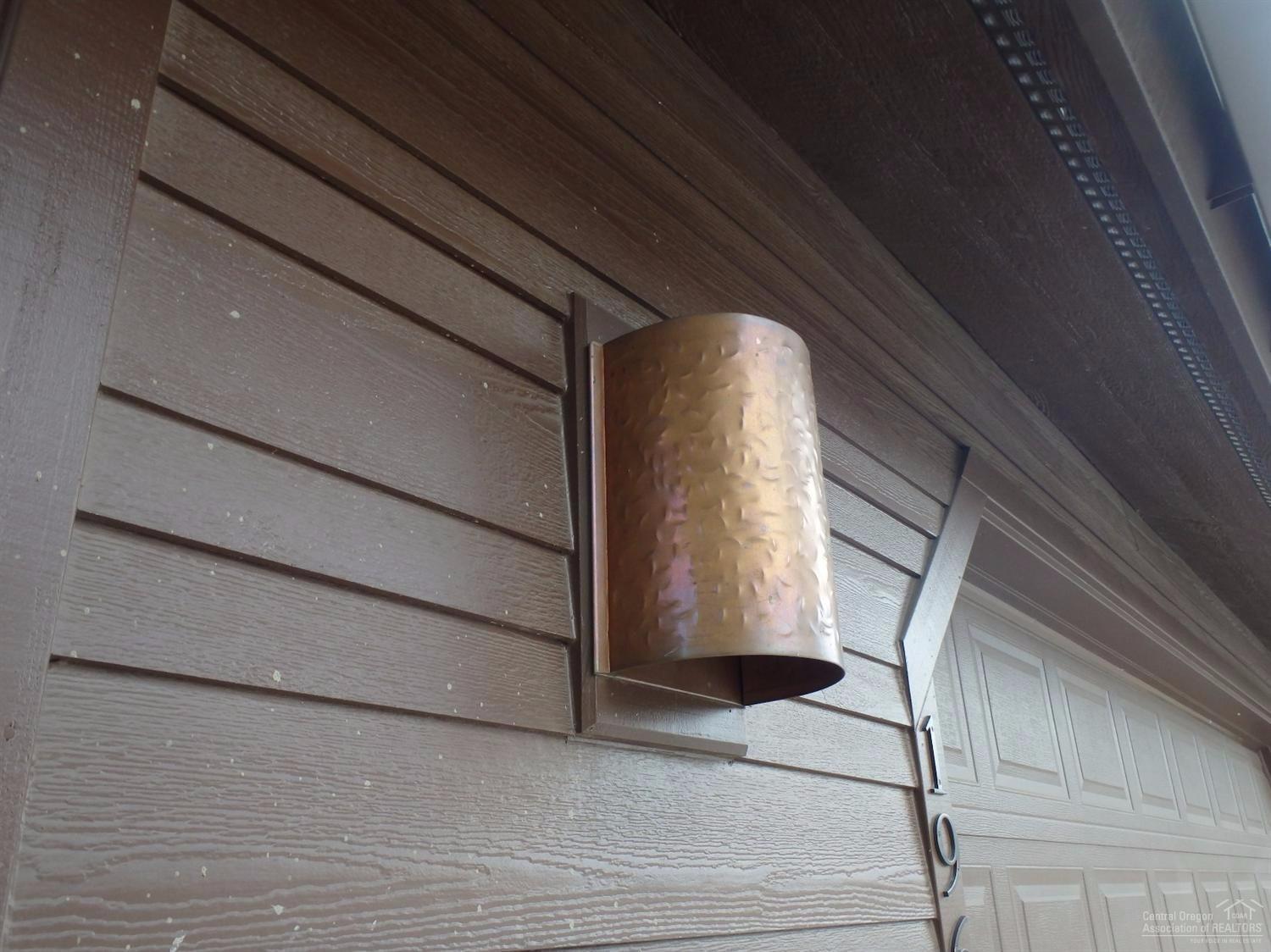 19619 Apache Road Bend, OR 97702 - Photo 3 of 25 Copper exterior light fixtures at garage