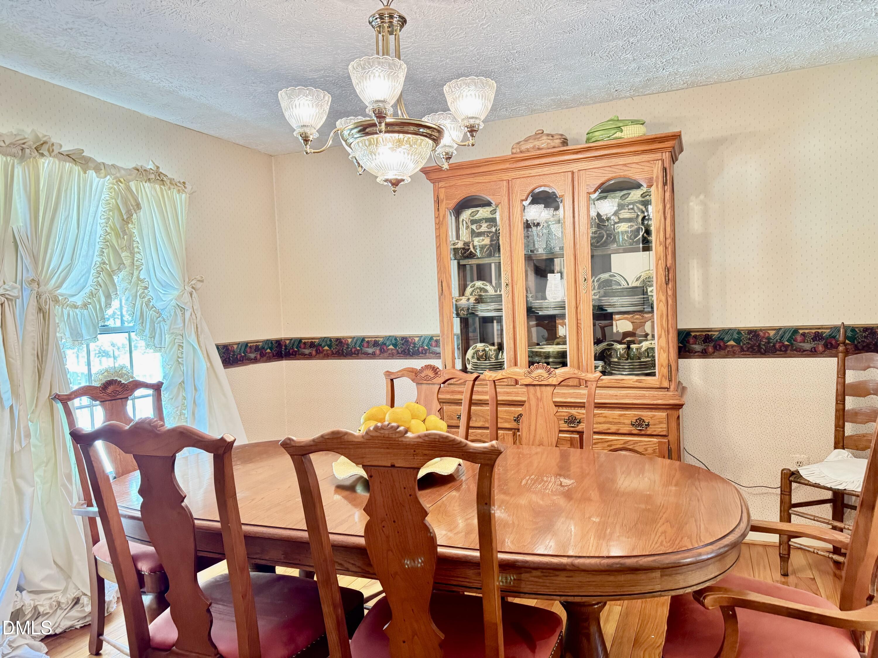 84 Wintergreen Road Henderson, NC 27537 - Photo 13 of 49 a view of a dining room with furniture window and outside view
