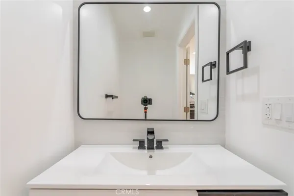 a view of a hallway with washer and dryer