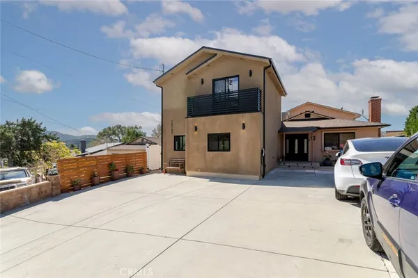 a car parked in front of a house