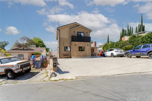 an aerial view of a house with a yard