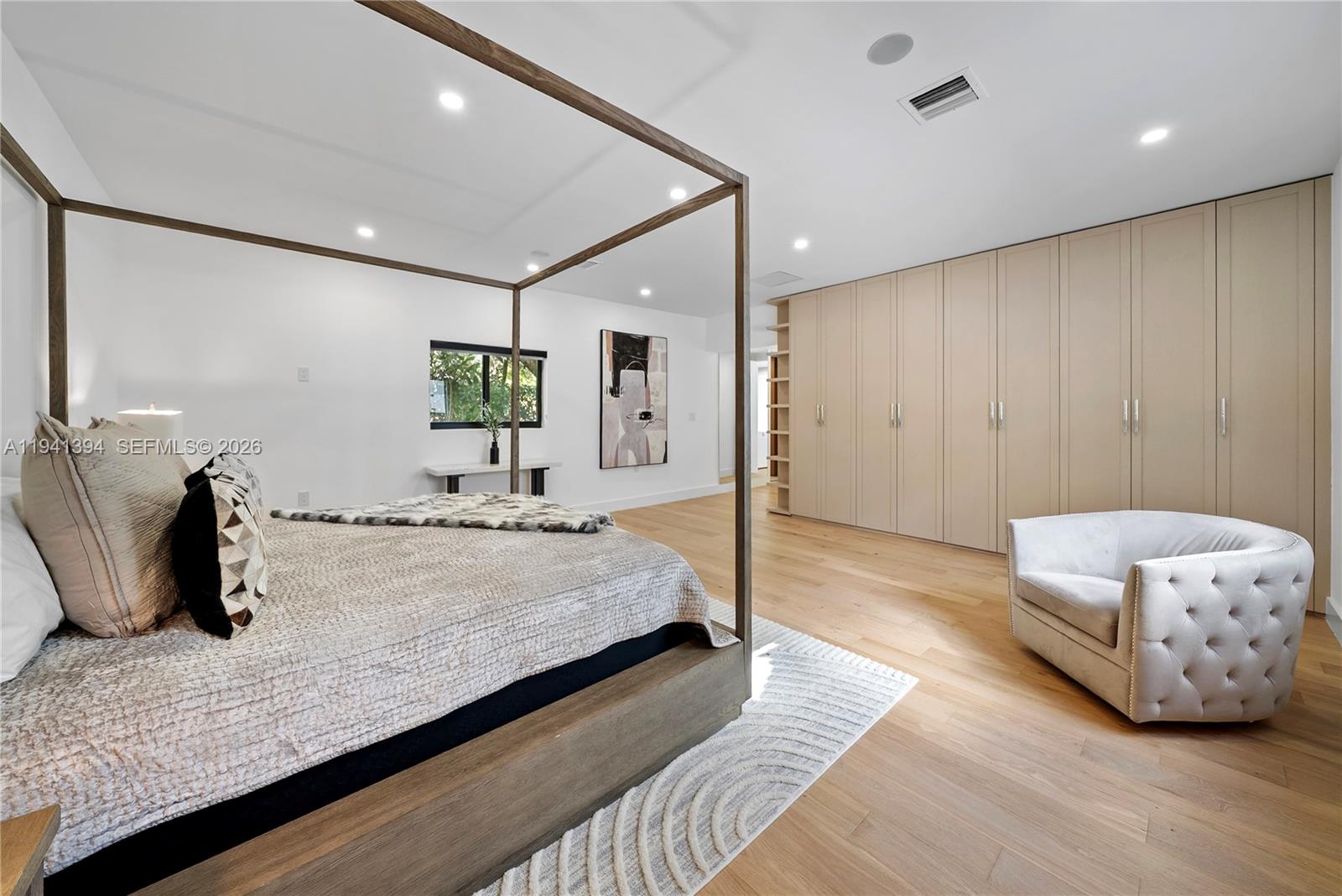 600 Northeast 57th Street Miami, FL 33137 - Photo 18 of 43 a spacious bedroom with a bed and a dresser with the shower