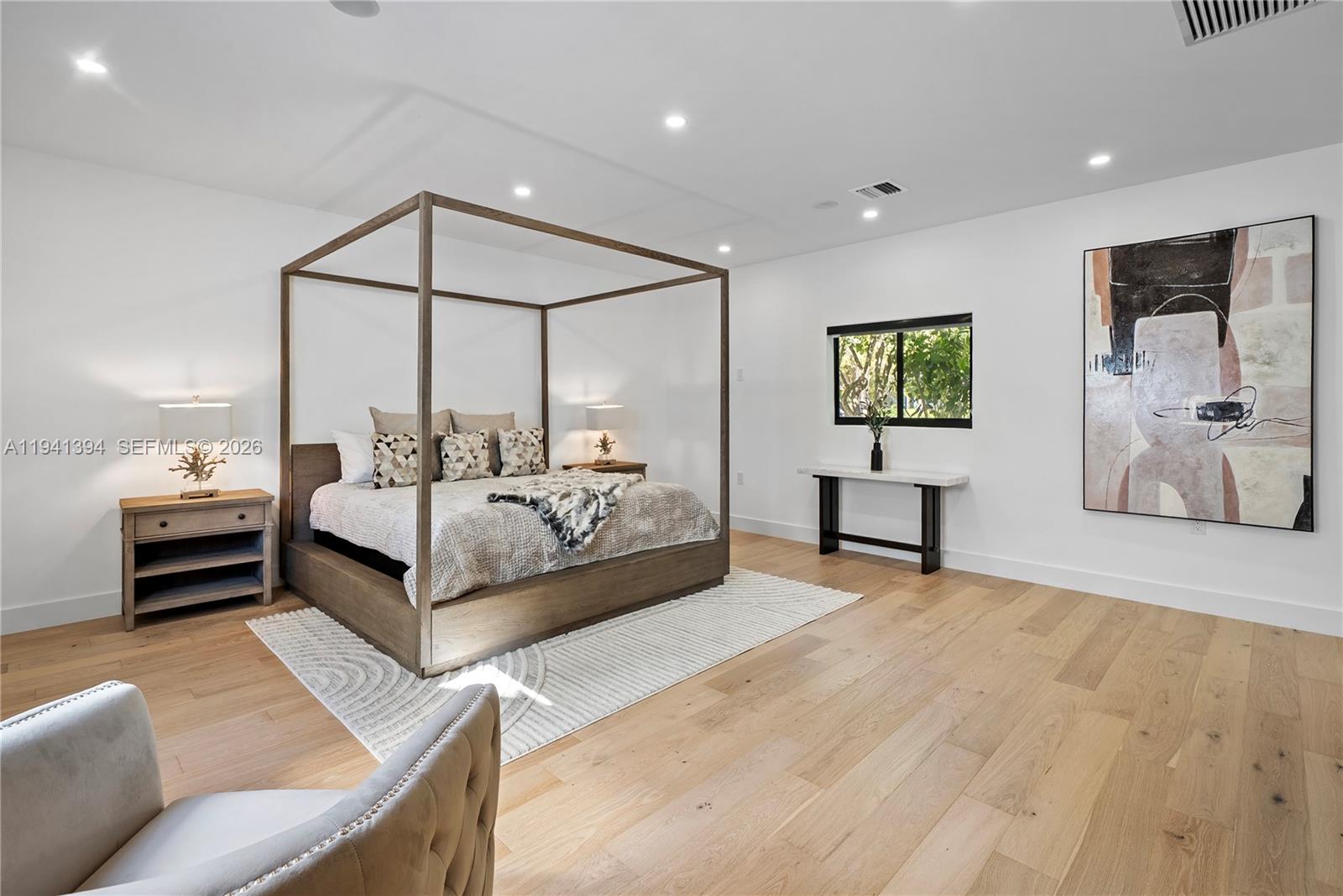 600 Northeast 57th Street Miami, FL 33137 - Photo 20 of 43 a bedroom with a bed window and couch