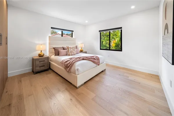 a bed room with a bed and a window