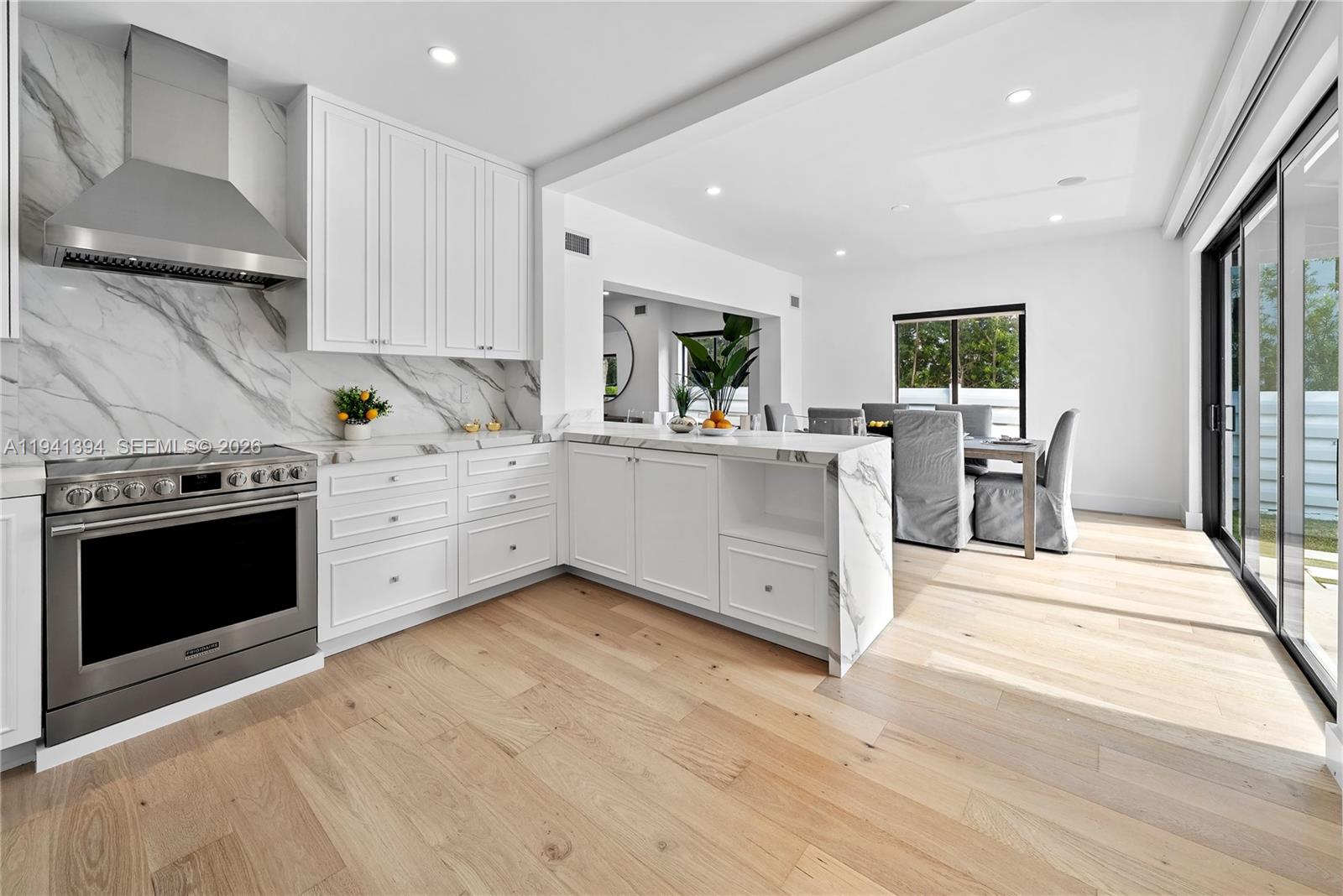 600 Northeast 57th Street Miami, FL 33137 - Photo 8 of 43 a view of a kitchen with stove and furniture