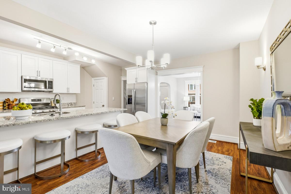 1526 Spring Place Northwest Washington, DC 20010 - Photo 11 of 35 a view of a dining room and kitchen with a table and chairs