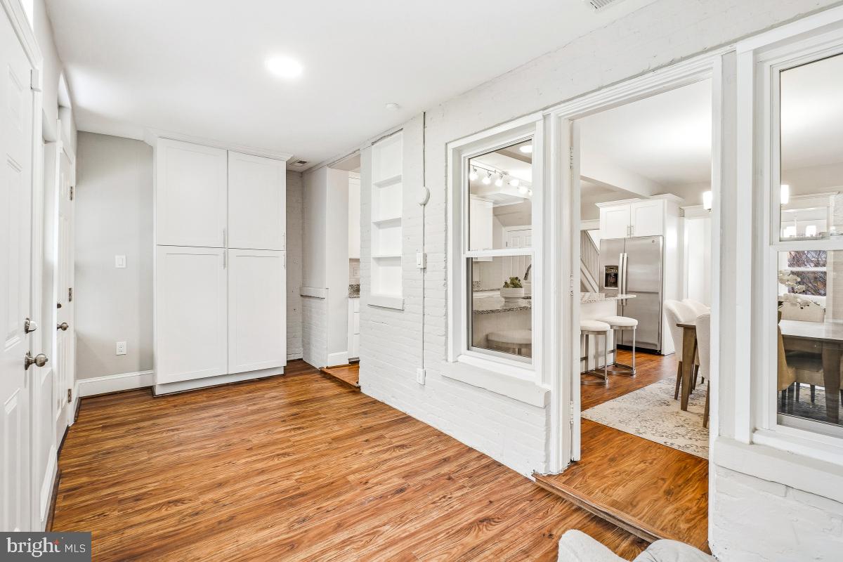 1526 Spring Place Northwest Washington, DC 20010 - Photo 17 of 35 a bedroom with a bed and wooden floor