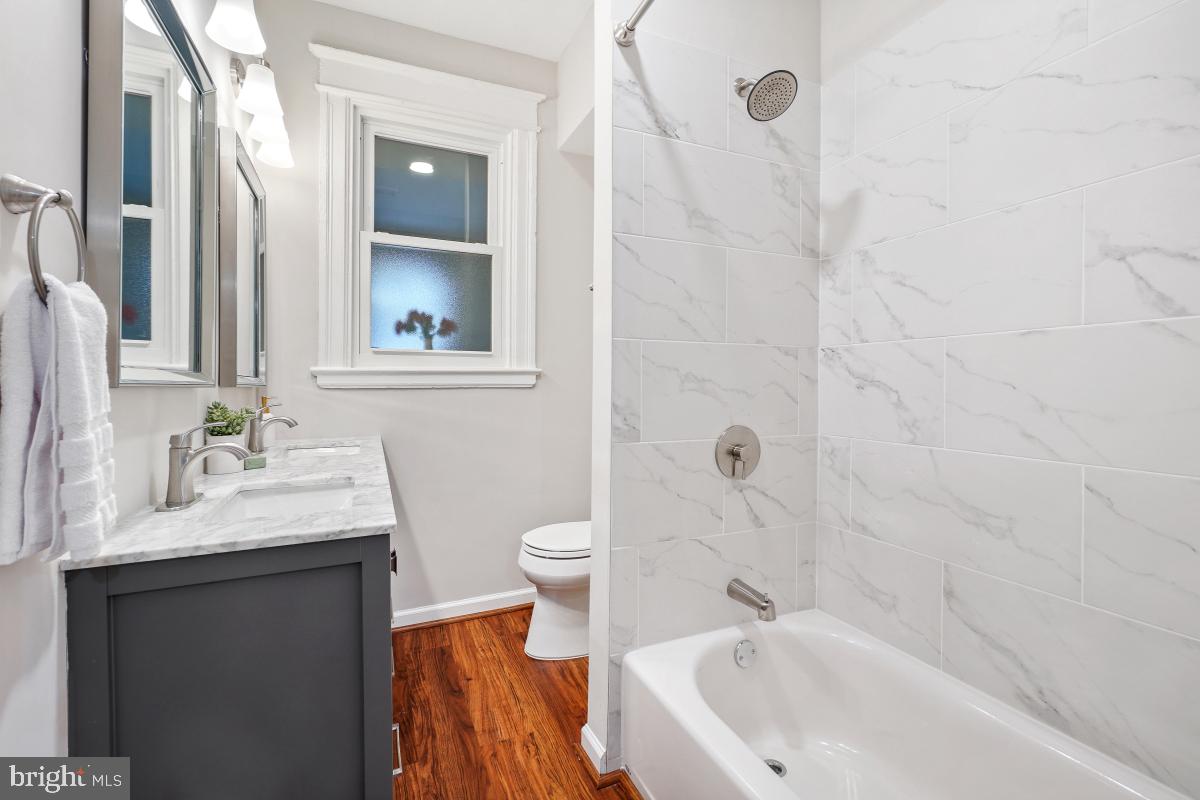 1526 Spring Place Northwest Washington, DC 20010 - Photo 19 of 35 a bathroom with a sink toilet and shower