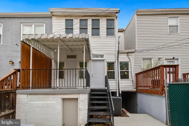 a view of a backyard and a chair