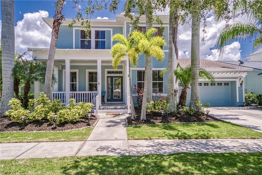 5725 Tortoise Place Apollo Beach, FL 33572 - Photo 1 of 1 a front view of a house with garden and plants