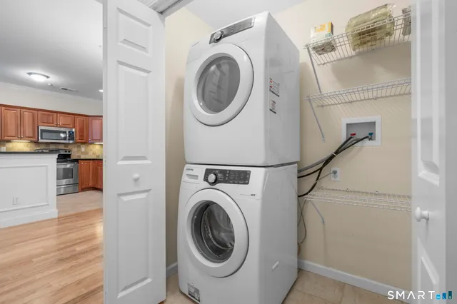a view of a hallway with washer and dryer