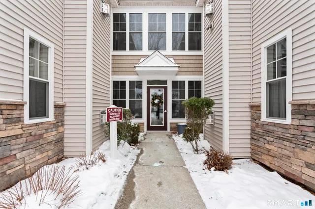 a front view of a house with patio