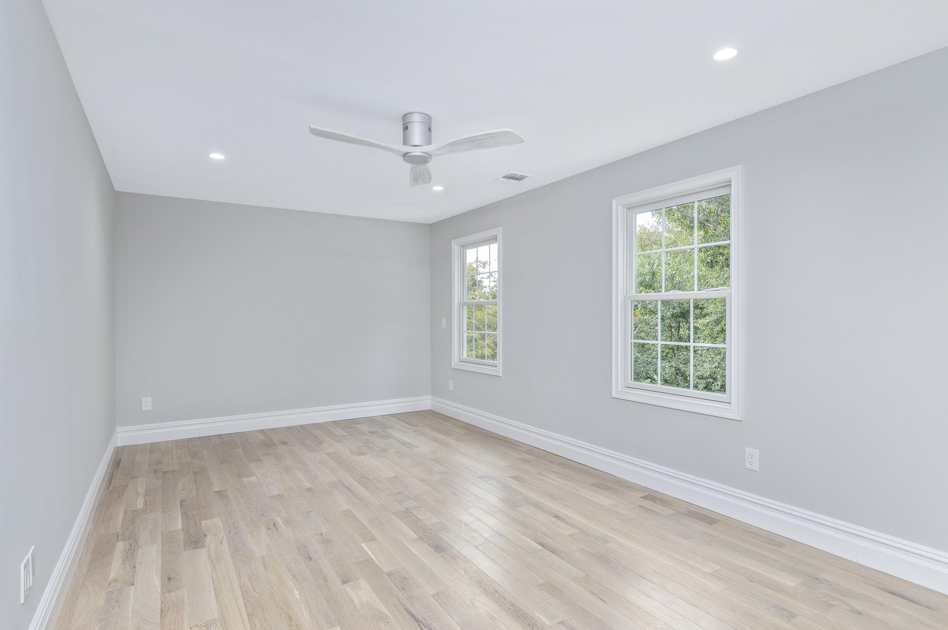 223 Town Line Road Commack, NY 11731 - Photo 16 of 32 a view of an empty room with a window