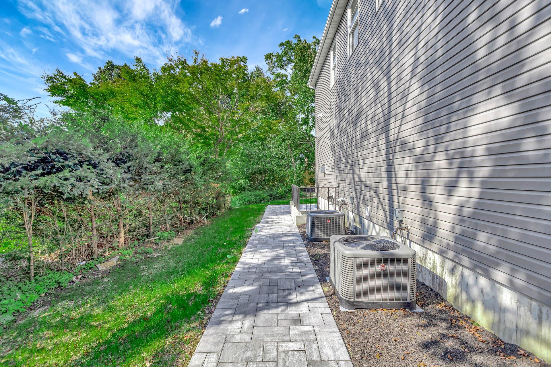 223 Town Line Road Commack, NY 11731 - Photo 27 of 32 a view of a pathway with a fountain
