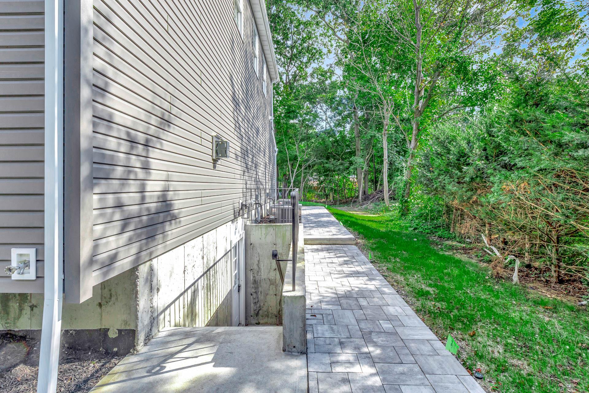 223 Town Line Road Commack, NY 11731 - Photo 28 of 32 a view of a pathway with a house