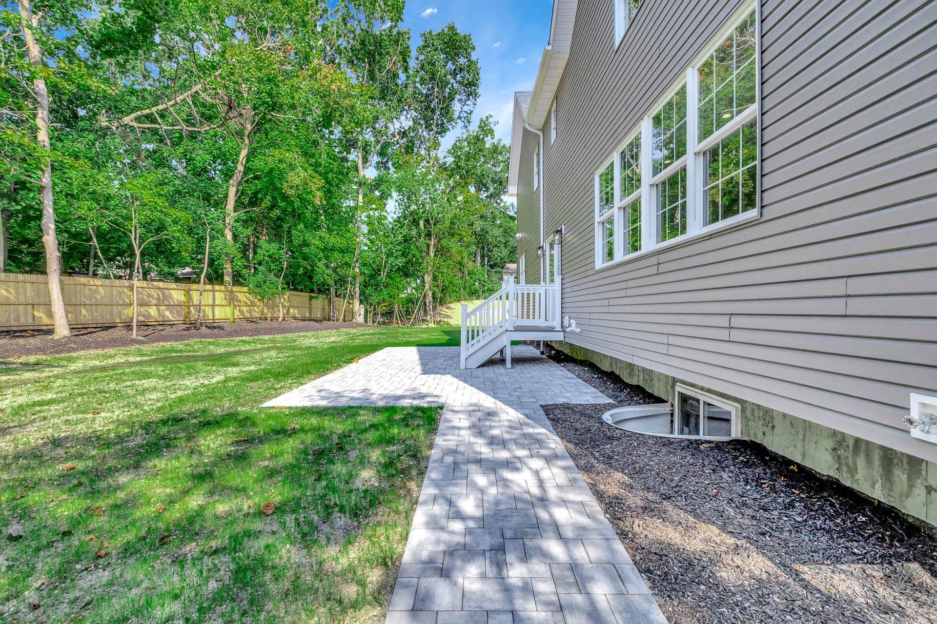 223 Town Line Road Commack, NY 11731 - Photo 29 of 32 a view of a backyard with a garden