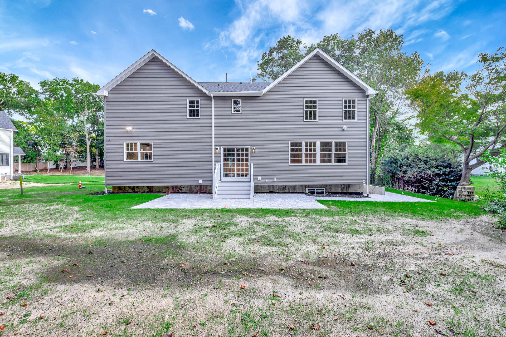 223 Town Line Road Commack, NY 11731 - Photo 30 of 32 a view of front a house with a yard