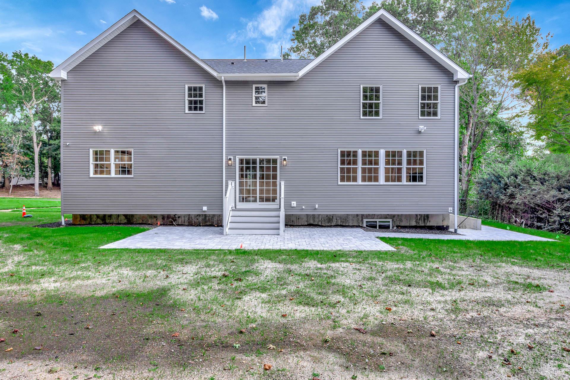 223 Town Line Road Commack, NY 11731 - Photo 31 of 32 a view of front of a house with a yard