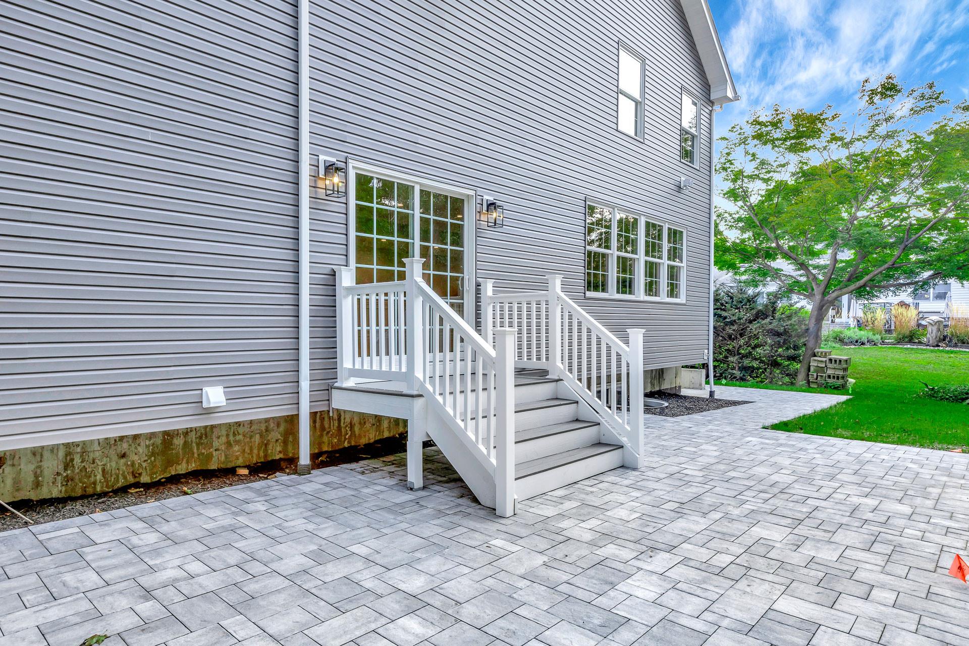 223 Town Line Road Commack, NY 11731 - Photo 32 of 32 a view of a house with a yard and a bench