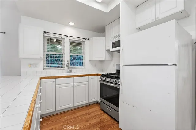 a kitchen that has a sink and a stove