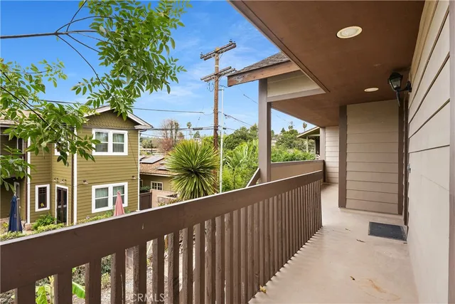 a hallway with cabinets and wooden floor
