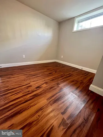 a view of room with wooden floor