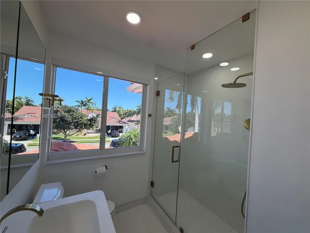 a view of walk in closet with wooden floor