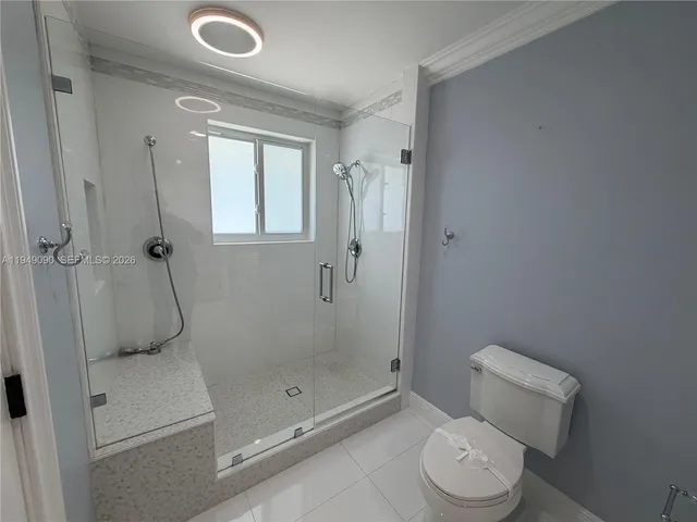 a view of a workspace with furniture and a potted plant