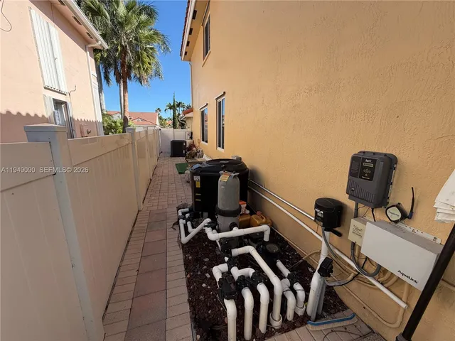 a kitchen with stainless steel appliances granite countertop a refrigerator and a cabinets