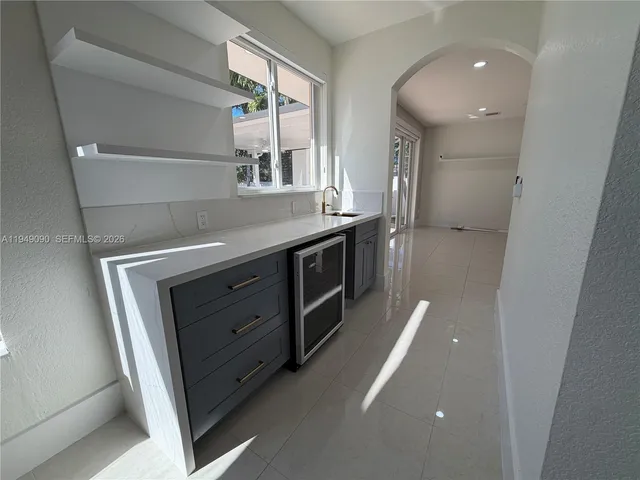 a view of walk in closet with clothes