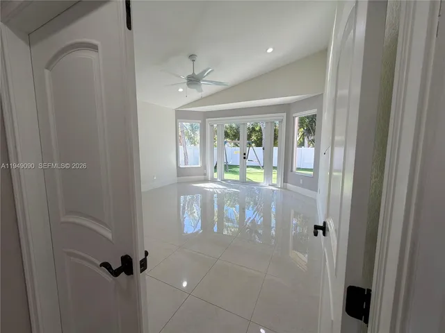 a bathroom with a granite countertop toilet sink and mirror