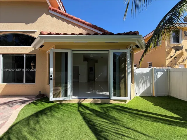 a large bathroom with a granite countertop sink mirror and shower