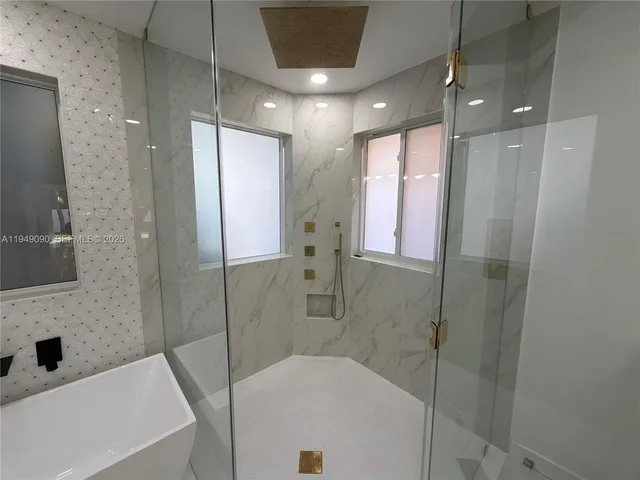 a view of a swimming pool with a deck