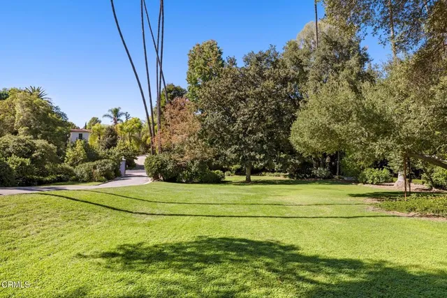 a view of an outdoor space and tennis court