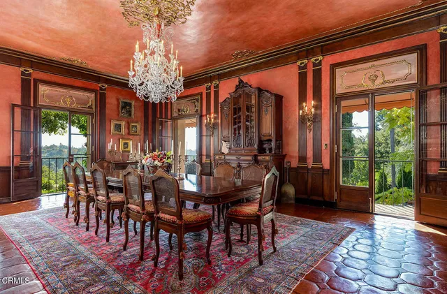 a dinning table and chairs in a kitchen