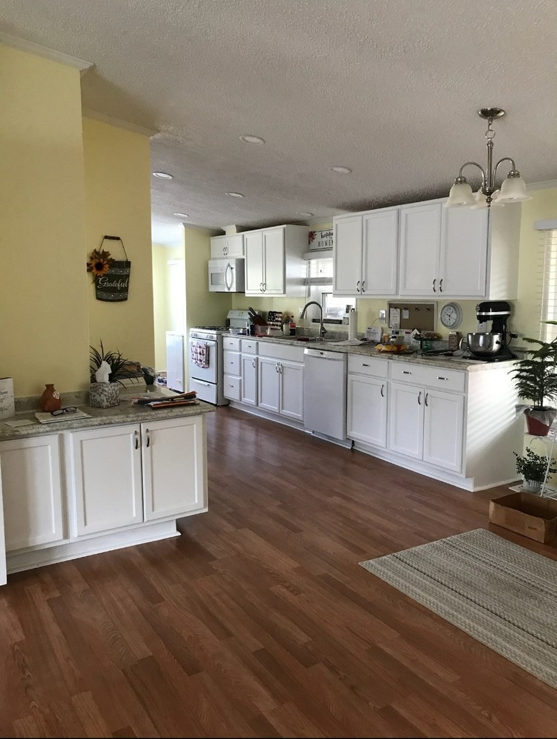 60 Cherry Lane Bourbonnais, IL 60914 - Photo 11 of 13 a kitchen with counter top space and appliances