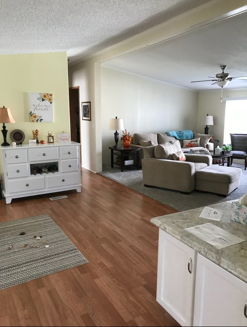 60 Cherry Lane Bourbonnais, IL 60914 - Photo 3 of 13 a living room with furniture and a wooden floor