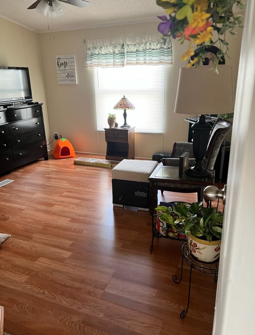 60 Cherry Lane Bourbonnais, IL 60914 - Photo 7 of 13 a living room with furniture and a flat screen tv