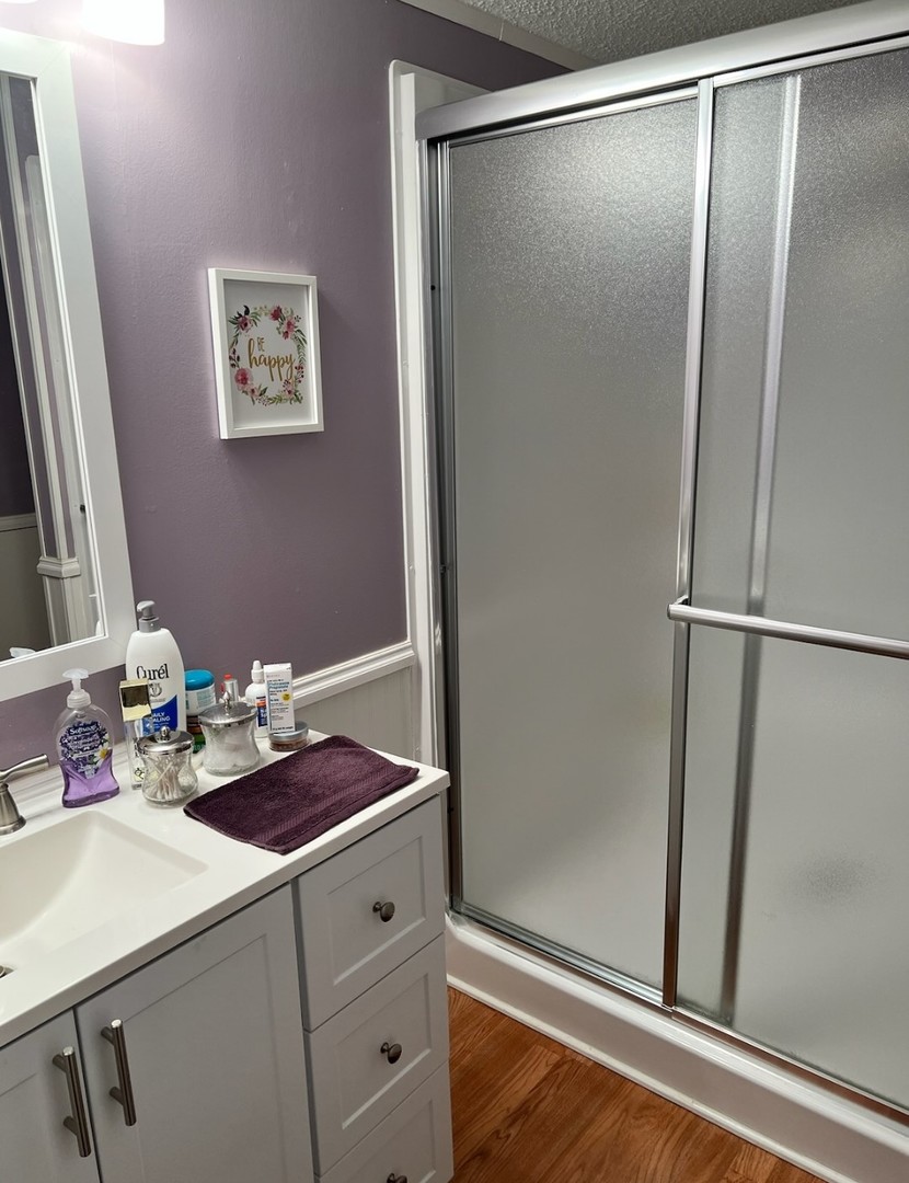 60 Cherry Lane Bourbonnais, IL 60914 - Photo 10 of 13 a bathroom with a sink and a mirror