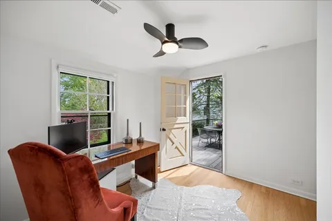 a living room with furniture tv and a window