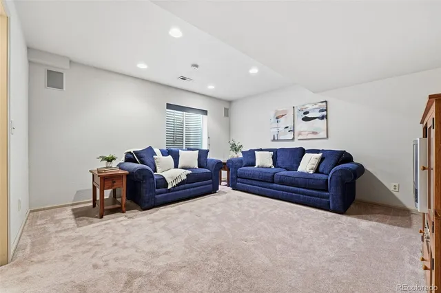a living room with furniture and a couch