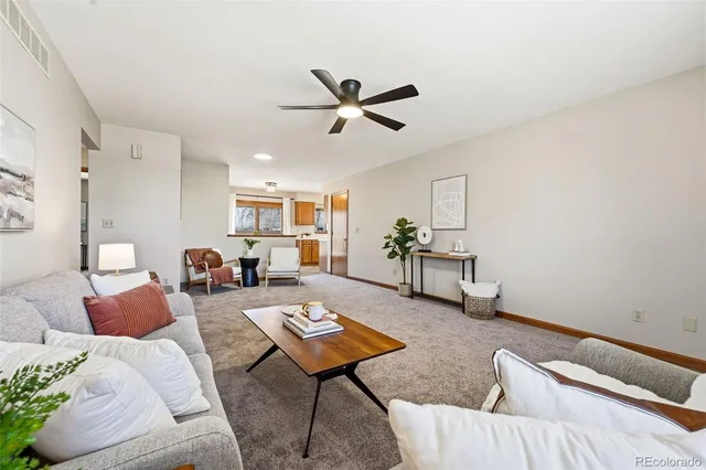 a living room with furniture and a rug